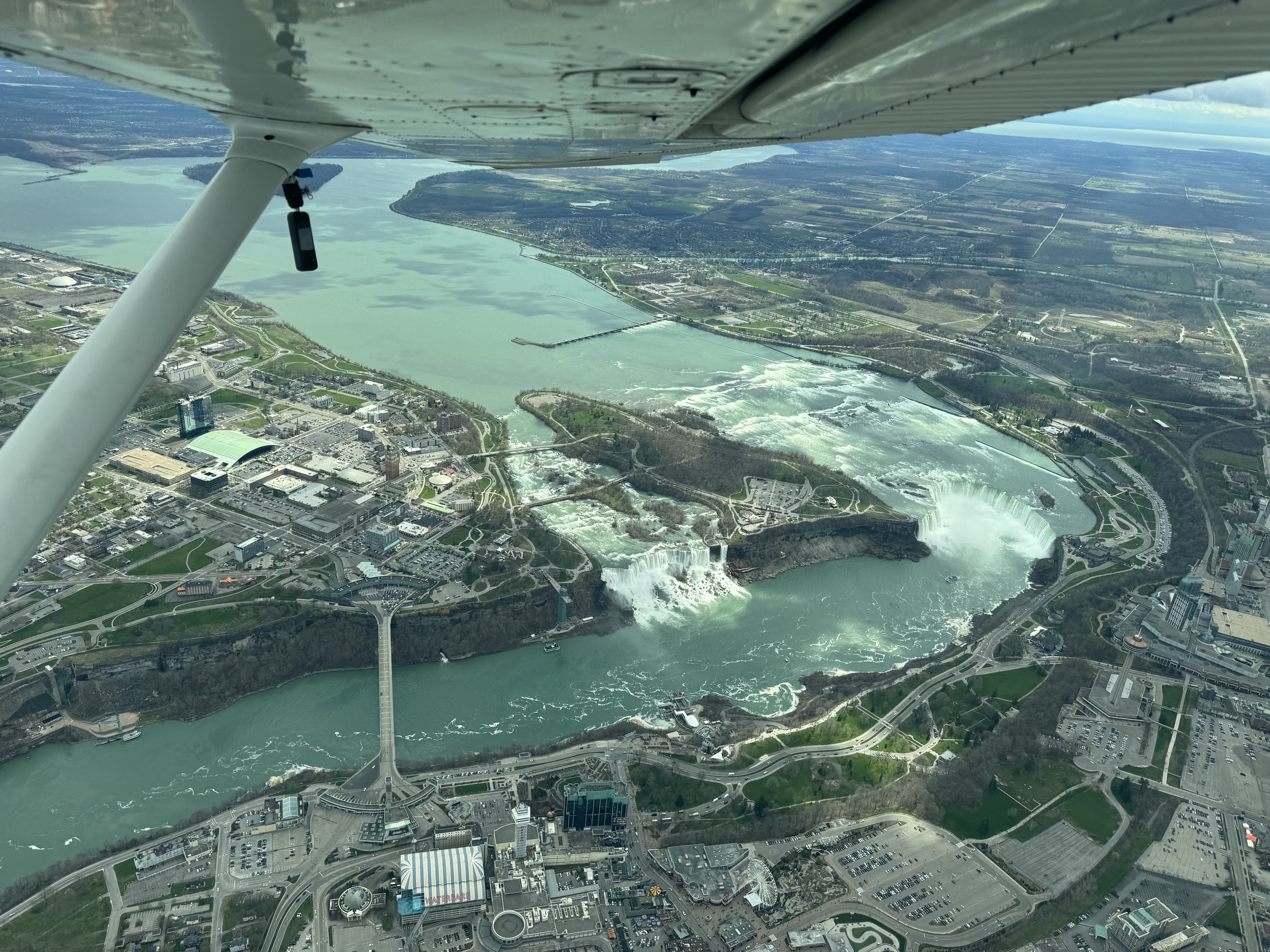 Niagara Falls under a Cessna wing and strut